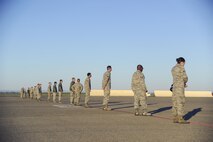 Approximately 40 Airmen assigned to the 940th Air Refueling Wing lined up in preparation for a foreign object debris walk of the flightline March 12, 2017, at Beale Air Force Base, California. Members from across the wing are invited to participate in the FOD walk to ensure the airfield is safe for the Airmen and the flying mission. (U.S. Air Force photo by Senior Airman Tara R. Abrahams)