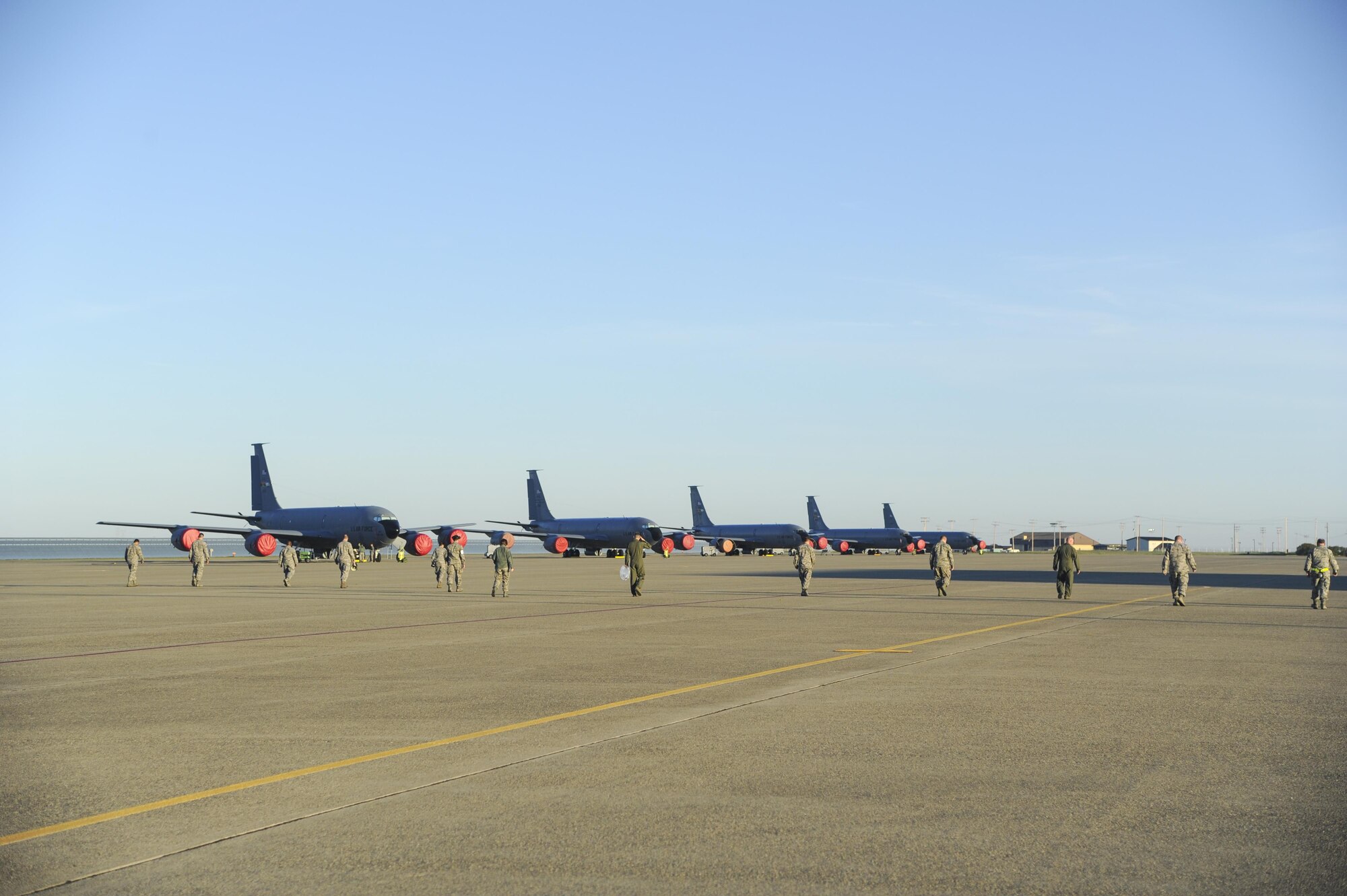 Members of the 940th Air Refueling Wing look for foreign object debris on the KC-135 area of the flightline March 12, 2017, at Beale Air Force Base, California. A FOD walk is performed because even the smallest debris can cause damage to aircraft and endanger the Airmen. (U.S. Air Force photo by Senior Airman Tara R. Abrahams)