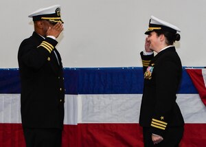 U.S. Navy Cdr. Teresa Ferry, left, relieves U.S. Navy Cdr. Stephen Jones, right, as Naval Operational Support Center Charleston commanding officer during a change of command ceremony at the Bowman Center on the Joint Base Charleston-Weapons Station, March 4, 2017. Ferry is arriving from Navy Reserve Forces Command while Jones is retiring after 20 years of service.