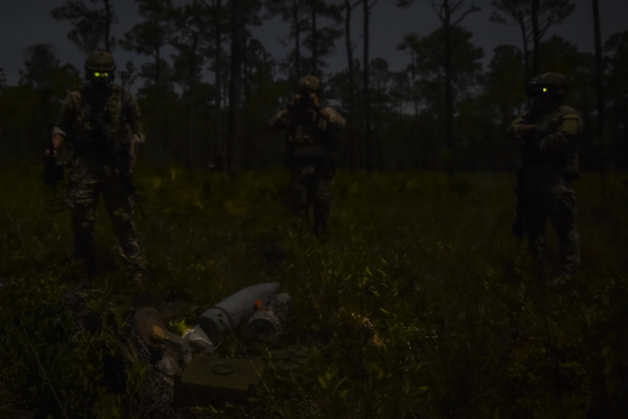 Explosive ordinance disposal Air Commandos with the 1st Special Operations Civil Engineer Squadron find a cache of explosive ordnance during training at the Eglin Range, Fla., March 9, 2017. Explosive ordnance cache training is conducted quarterly by the EOD Airmen to ensure readiness to execute operations. (U.S. Air Force photo by Airman 1st Class Joseph Pick)