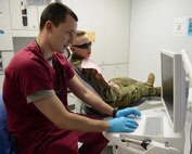 U.S. Army Capt. Tyler Oatmen, U.S. Army Dental Command dentist, explains a treatment plan to a patient at the Tignor Dental Clinic at Joint Base Langley-Eustis, Va., March 10, 2017. Technicians and dentists see approximately 7,000 Soldiers annually within the 28-chair clinic. (U.S. Air Force photo/Staff Sgt. Teresa J. Cleveland)