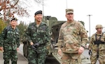Maj. Gen. Mark Stammer (right), I Corps deputy commanding general, greets Royal Thai Army Lt. Gen. Apirat Kongsompong, First Army Area commander in Thailand, after a ride in a Stryker vehicle at Joint Base Lewis-McChord, Mar. 8, 2017.  Apirat was visiting to learn more about the Stryker vehicle platform that is frequently used by Soldiers from the installation. I Corps is regionally aligned to the Pacific and works with a number of nations, to include Thailand, every year in efforts to build security cooperation throughout the region. 