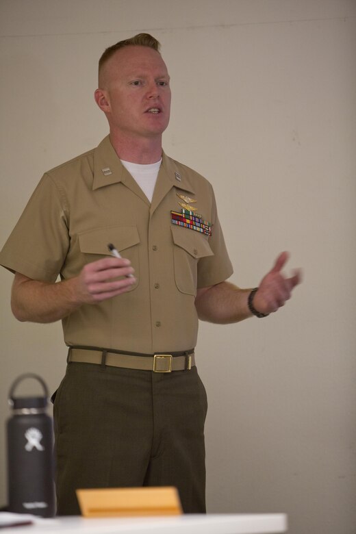 Capt. Scott L. Campbell, maintenance officer with Marine Aviation Weapons and Tactics Squadron (MAWTS) One, welcomes students attending the first Advanced Aircraft Maintenance Officer Course (AAMOC) at Marine Corps Air Station Yuma, Ariz., on March 13, 2017. AAMOC will empower Aircraft Maintenance Officers with leadership tools, greater technical knowledge and standardized practices through rigorous academics and hands on training in order to decrease ground related mishaps and increase sortie generation. (U.S. Marine Corps photo taken by Cpl. AaronJames B. Vinculado/Released)