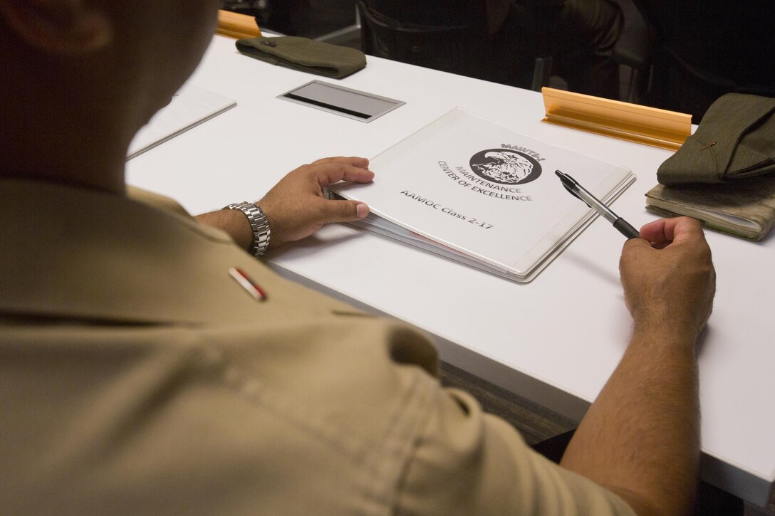 Marines attend a welcome aboard brief for the first Advanced Aircraft Maintenance Officer Course (AAMOC) at Marine Corps Air Station Yuma, Ariz., March 13, 2017. AAMOC will empower Aircraft Maintenance Officers with leadership tools, greater technical knowledge and standardized practices through rigorous academics and hands on training in order to decrease ground related mishaps and increase sortie generation. (U.S. Marine Corps photo taken by Cpl. AaronJames B. Vinculado/Released)