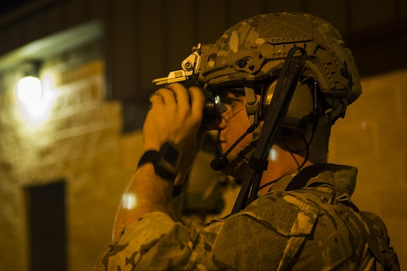 Senior Airman John Nipp, an explosive ordnance disposal journeyman with the 1st Special Operations Civil Engineer Squadron, checks his night-vision goggles before training at Hurlburt Field, Fla., March 9, 2017. EOD Airmen cleared more than a mile of roadways and disabled several simulated caches of explosive ordnance during training. (U.S. Air Force photo by Airman 1st Class Joseph Pick)