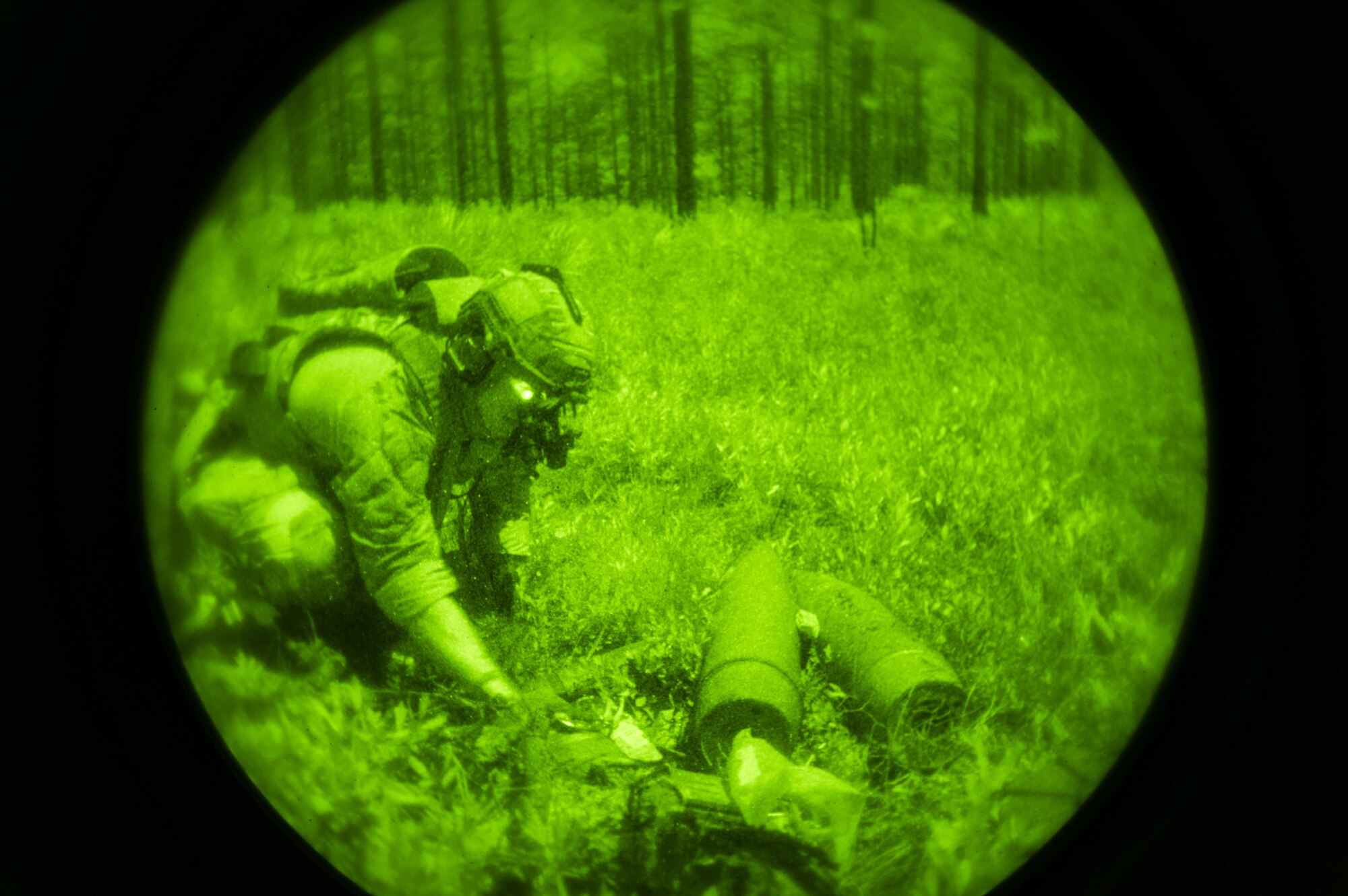 Airman 1st Class Ashton Flynt, an explosive ordnance disposal journeyman with the 1st Special Operations Civil Engineer Squadron, inspects an explosive ordnance cache during training at Eglin Range, March 9, 2017. Explosive ordnance cache training is conducted quarterly by the EOD Airmen to ensure continued readiness to execute operations. (U.S. Air Force photo by Airman 1st Class Joseph Pick)