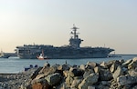 The aircraft carrier USS Carl Vinson (CVN 70) approaches the Republic of Korea (ROK) Fleet headquarters. The Carl Vinson Carrier Strike Group is on a regularly scheduled Western Pacific deployment as part of the U.S. Pacific Fleet-led initiative to extend the command and control functions of U.S. 3rd Fleet. 