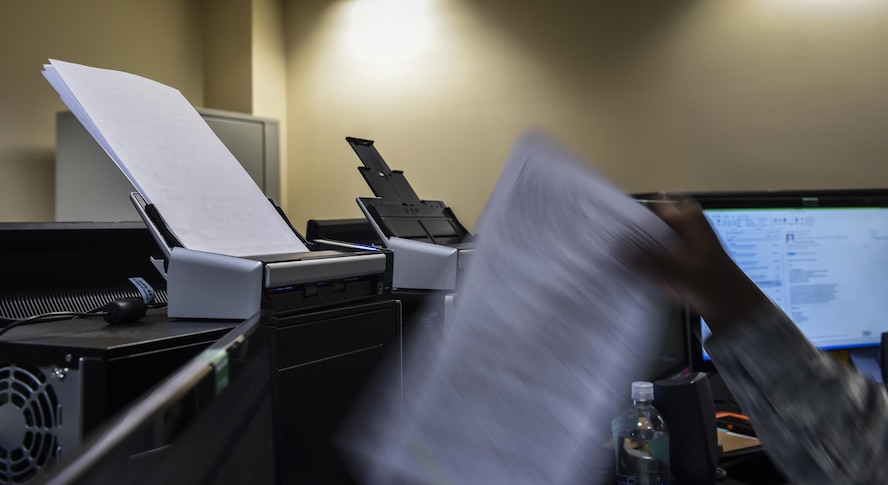 Airman 1st Class Adrian Basfield, a re-enlistment and extension technician with the 1st Special Operations Force Support Squadron, reviews re-enlistment folders for accuracy and discrepancies at the Military Personnel Flight on Hurlburt Field, Fla., March 14, 2017. Personnelists with the 1st SOFSS are broken into five sections: assignments, force management, promotions, re-enlistment and extensions, and retirement and separations. (U.S. Air Force photo by Airman 1st Class Joseph Pick)