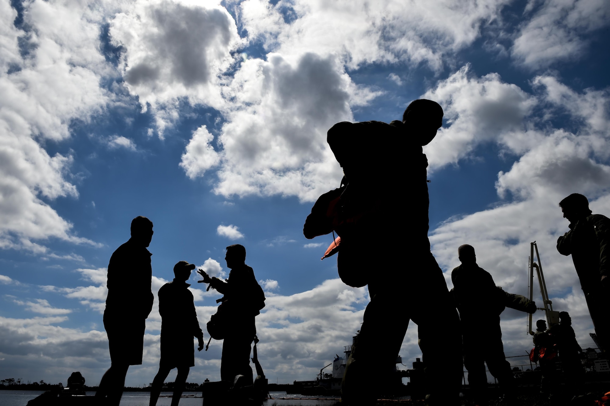 Aircrew members participate in water survival training at Hurlburt Field, Fla., March 14, 2017. Water survival training is required for aircrew tri-annually to maintain proficiency on skill sets such as canopy disentanglement, parachute drop and drag, and life raft boarding. (U.S. Air Force photo by Airman 1st Class Joseph Pick)
