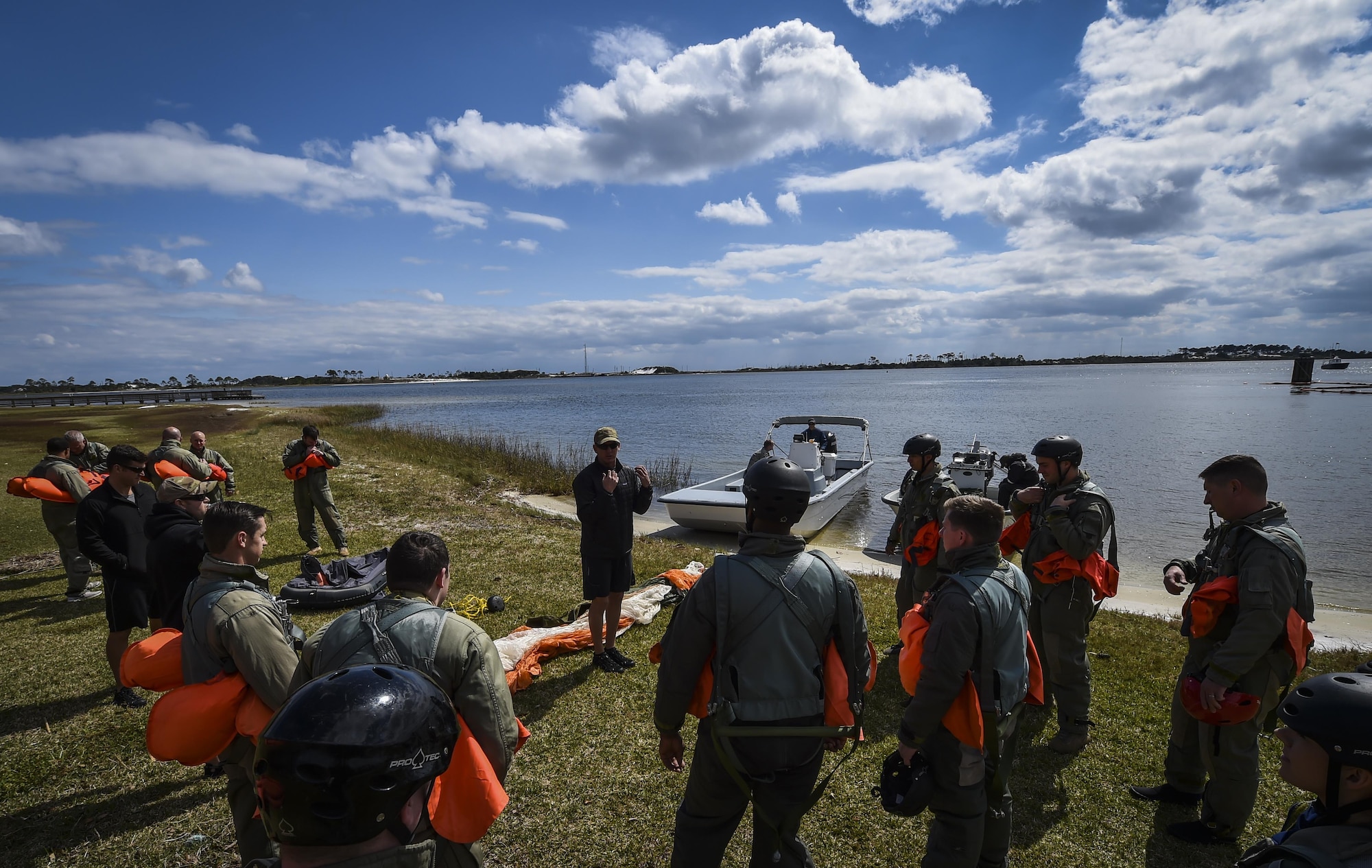 Staff Sgt. Tommy Dreher, a survival, evasion, resistance and escape specialist with the 1st Special Operations Support Squadron, instructs aircrew during water survival training at Hurlburt Field, Fla., March 14, 2017. SERE specialists with the 1st SOSS instructed aircrew on three different required refresher trainings tri-annually to ensure aircrew are ready to execute operations. (U.S. Air Force photo by Airman 1st Class Joseph Pick)