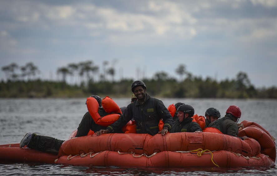 Aircrew members participate in water survival training at Hurlburt Field, Fla., March 14, 2017. Water survival training is required for aircrew tri-annually to maintain proficiency on skill sets such as canopy disentanglement, parachute drop and drag, and life raft boarding. (U.S. Air Force photo by Airman 1st Class Joseph Pick)