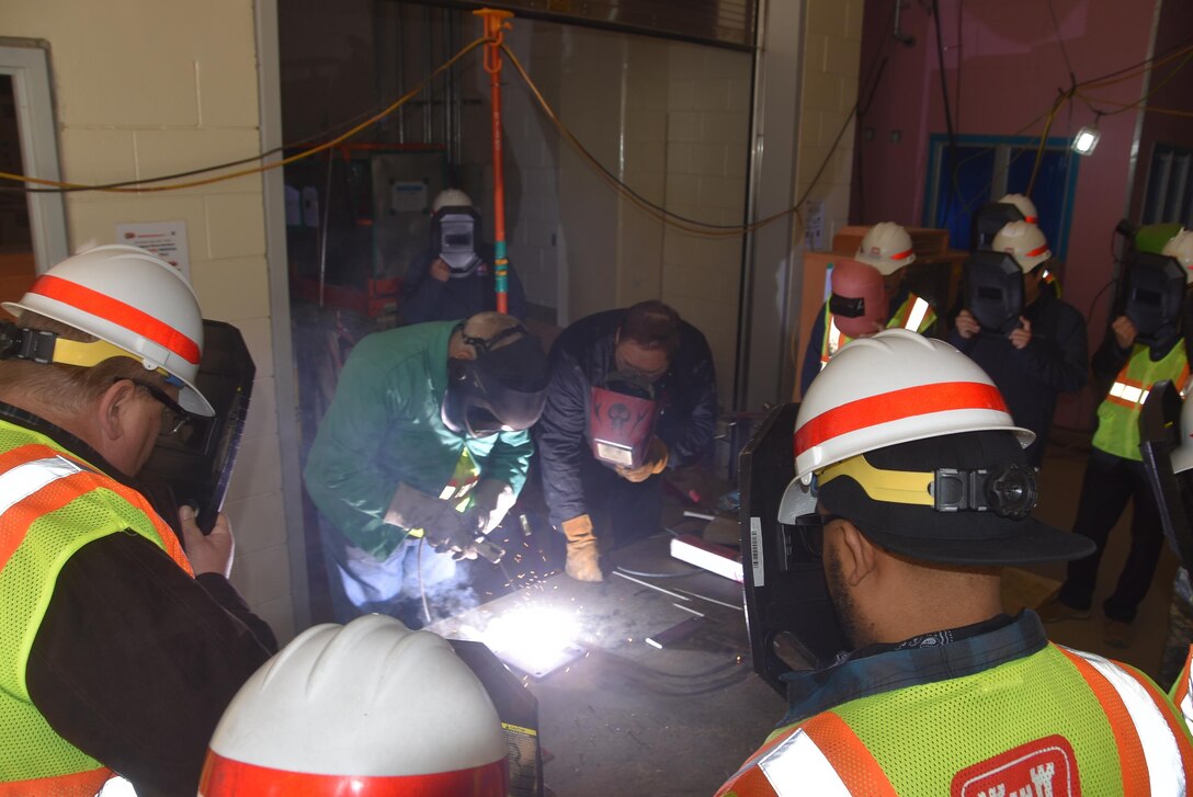 A class participant welds a piece of metal during the United States Army Corps of Engineers Far East District quality verification course March 13-17, 2017. The course teaches the participant how to interpret the various methods and techniques employed in weldments and assuring the quality of welds. 