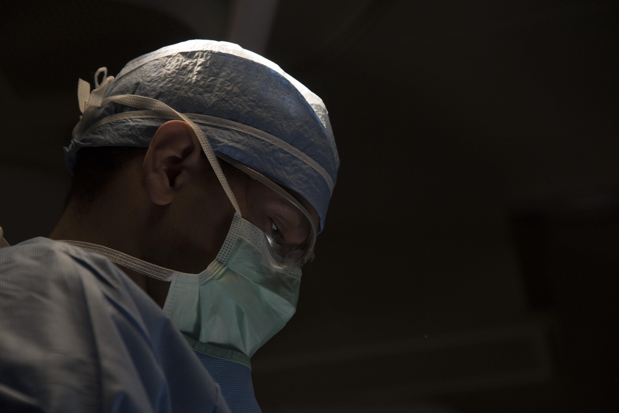 U.S. Air Force Senior Airman Dante Rankin, a 35th Surgical Squadron surgical services technician, readies equipment for a surgery at Misawa Air Base, Japan, March 15, 2017. Senior surgeon mentors, sponsored by the Air Force Medical Operations Agency, traveled to many small bases to share their wealth of knowledge. (U.S. Air Force photo by Airman 1st Class Sadie Colbert)