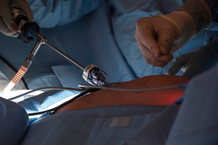 Lt. Col. Shawnn Nichols, a 959th Medical Group general surgeon, surgeon oncologist and program mentor, oversees a surgery as Capt. Lee Hafen, a 35th Medical Group general surgeon, exposes an appendix at Misawa Air Base, Japan, March 13, 2017. Misawa was chosen as the first base to test the Small Hospital Clinic Skills Enhancement program. (U.S. Air Force photo/Airman 1st Class Sadie Colbert)