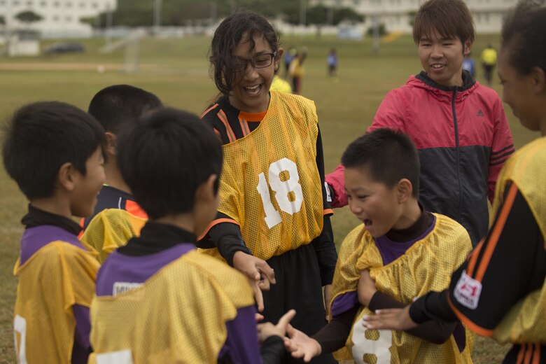 Players laugh and play Japanese and American games to decide who will substitute into the Marine Corps Community Services’ Friendship Soccer Game March 11 aboard Camp Foster, Okinawa, Japan. Yomitan Elementary School’s soccer team and Marine Corps Community Services’ soccer team, The Bandits, divided evenly into two teams for this event. “It was wonderful to see them playing together and making new friends during this competitive but friendly game,” said Satoru Sakumoto, the MCCS youth sports coordinator. “We hope to do this again soon.”