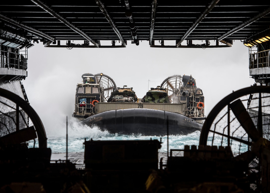 U.S. 5TH FLEET AREA OF OPERATIONS (Feb. 18, 2107) Landing Craft, Air Cushion 79, assigned to Assault Craft Unit 5, approaches the well deck of the amphibious assault ship USS Makin Island (LHD 8). Makin Island is deployed in the U.S. 5th Fleet area of operations in support of maritime security operations designed to reassure allies and partners and preserve the freedom of navigation and the free flow of commerce in the region. (U.S. Navy photo by Mass Communication Specialist 3rd Class Devin M. Langer)