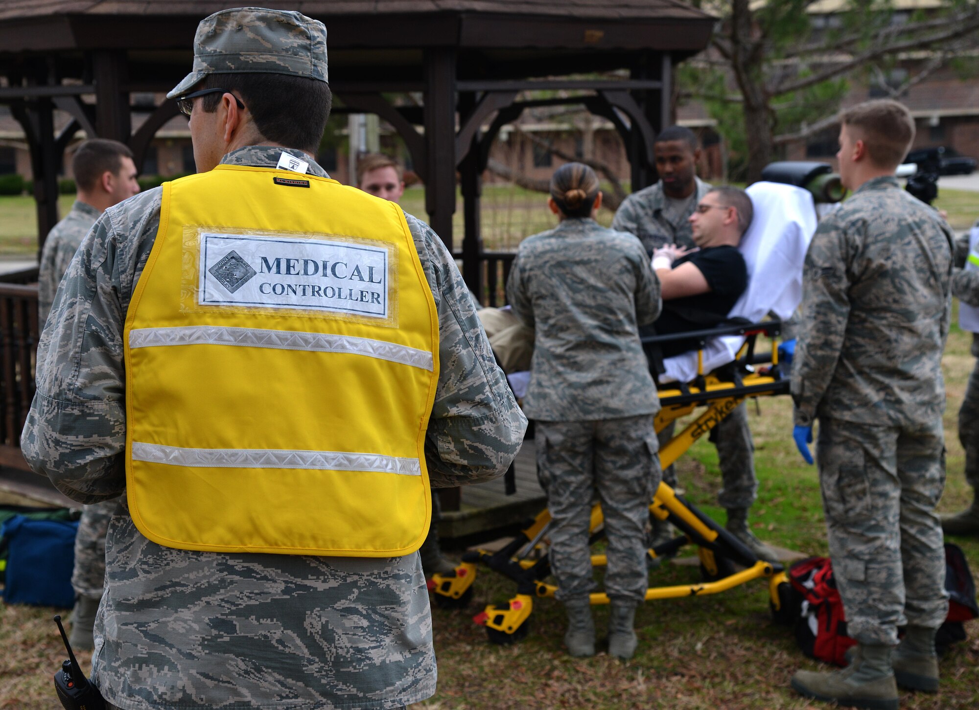 U.S. Air Force Maj. Robert Boulier, 633rd Medical Support Squadron pharmacy flight operations officer and wing inspection team member, watches as first responders treat a simulated patient during an exercise at Joint Base Langley- Eustis, Va., Feb. 22, 2017. Wing Inspection Team members are trained by the 633rd Air Base Wing Inspector General’s office to inspect and assess units during exercises. (U.S. Air Force photo/Airman 1st Class Tristian Biese)