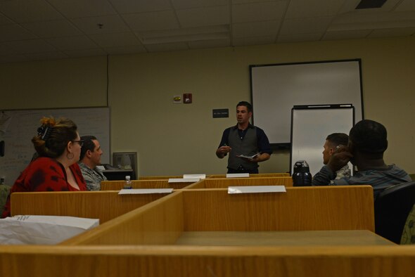 U.S. Air Force Staff Sgt. Christopher Stecker, 20th Equipment Maintenance Squadron munitions controller, leads a discussion on the philosophy of superheroes at Shaw Air Force Base, S.C., March 14, 2017. The discussion lasted two and a half hours and was focused on the ideas of good, evil and objective morality. (U.S. Air Force photo by Airman 1st Class Destinee Sweeney)