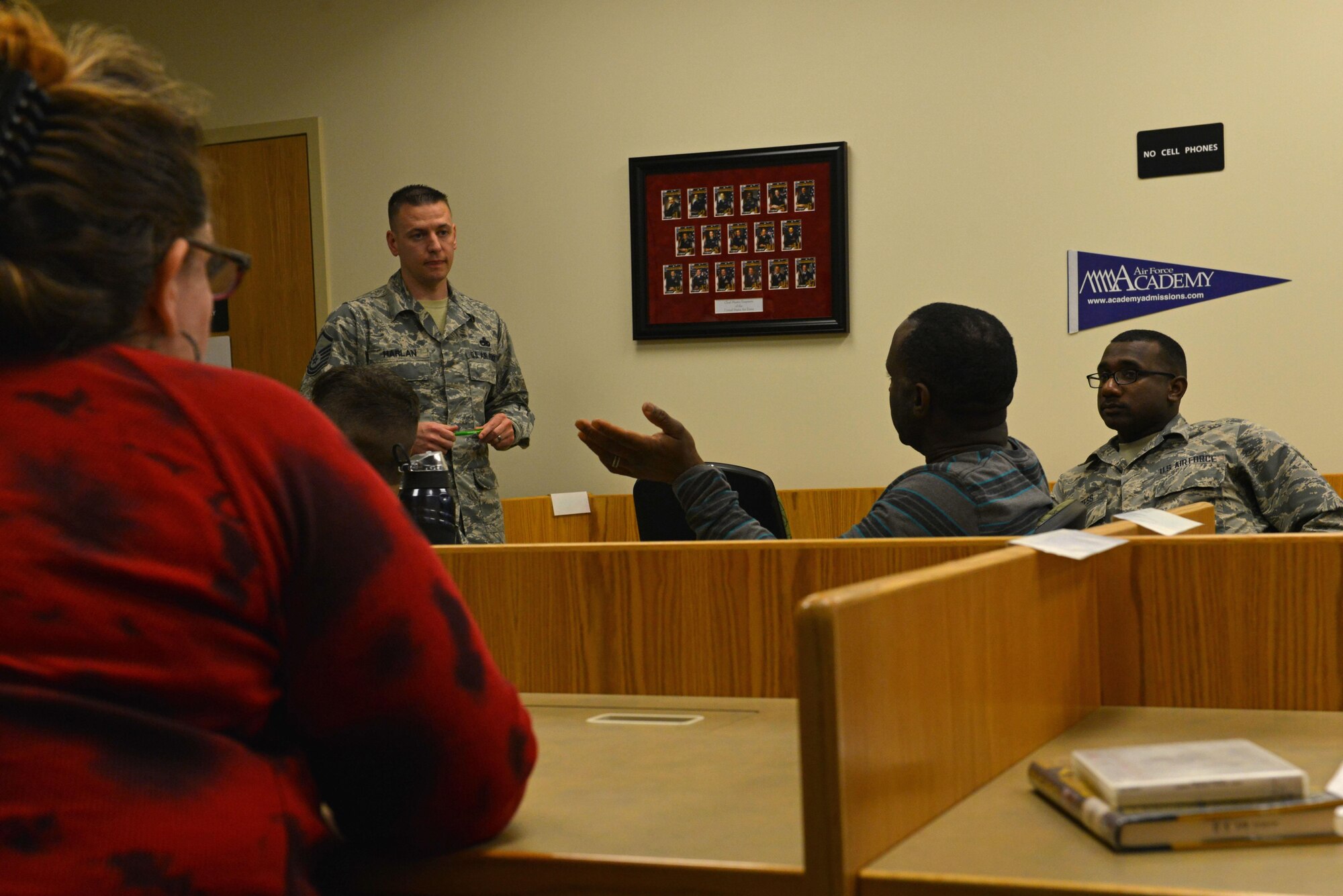 U.S. Air Force Master Sgt. Jason Harlan, 20th Equipment Maintenance Squadron munitions operations noncommissioned officer in charge, center left, listens to a question from one of the attendees of the Shaw Philosophy Society at Shaw Air Force Base, S.C., March 14, 2017. The group meets every second Tuesday of the month to discuss philosophical ideas such as moral dilemmas and ethics. (U.S. Air Force photo by Airman 1st Class Destinee Sweeney)