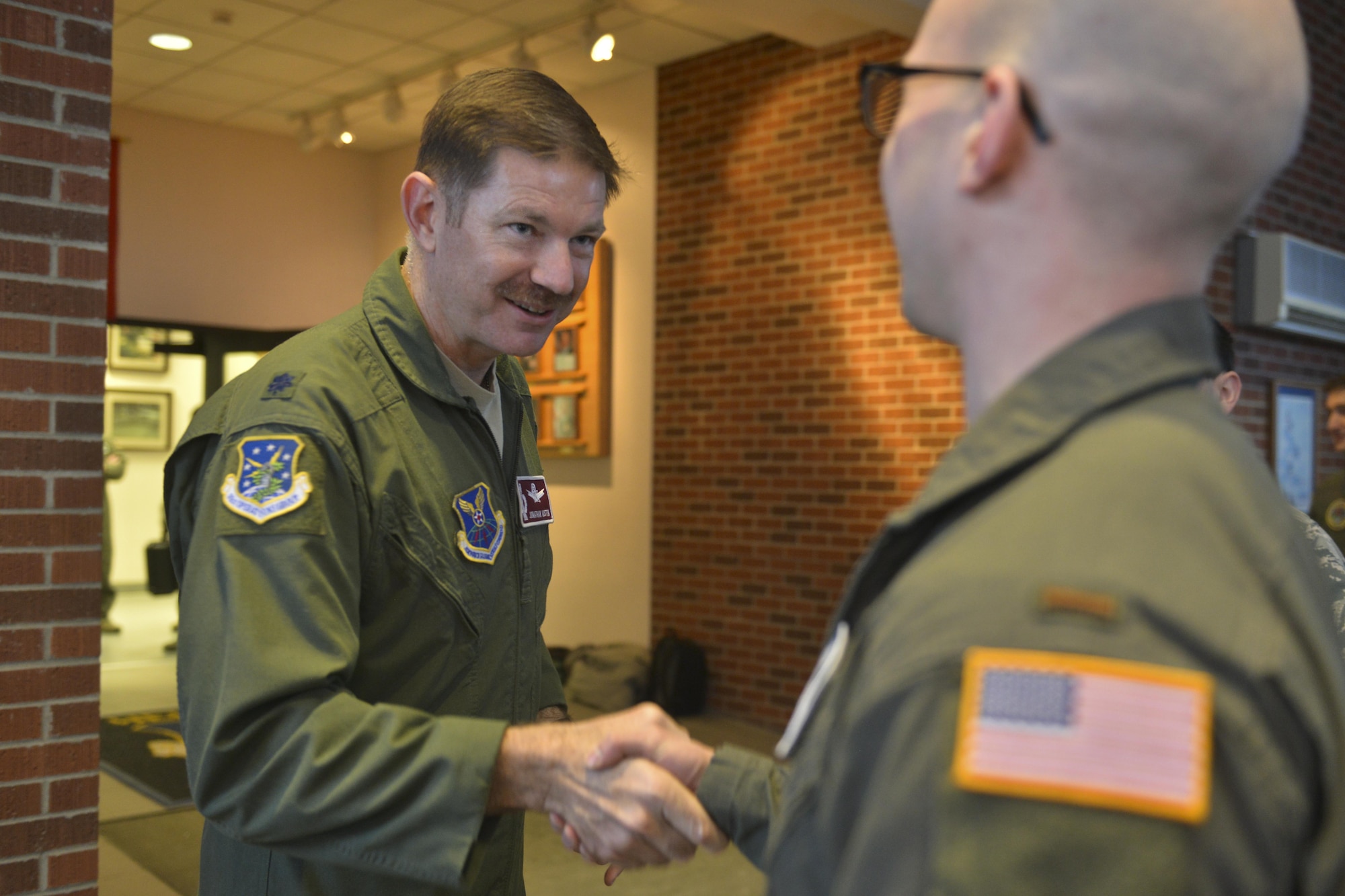 A 741st Missile Squadron operator stands after receiving a 48 hour alert pin at Minot Air Force Base, N.D., March 15, 2017. Operators receive messages from the National Military Command System and respond to messages while driving missile operations. (U.S. Air Force photo/Airman 1st Class Jessica Weissman)