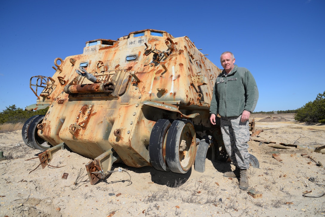 U.S. Air Force Master Sgt. Bryan ONeill, range section chief at the 177th Fighter Wing Det. 1 - Warren Grove Bombing Range in Ocean County, N.J., stands beside a demilitarized M88A1 armored recovery vehicle on Mar. 2, 2017. The M88 armored recovery vehicle, acquired from the Defense Logistics Agency, was designed for medium and heavy recovery operations including recovery of damaged, stuck, swamped or overturned armored vehicles on the battlefield. (U.S. Air National Guard photo by Master Sgt. Andrew J. Moseley/Released)