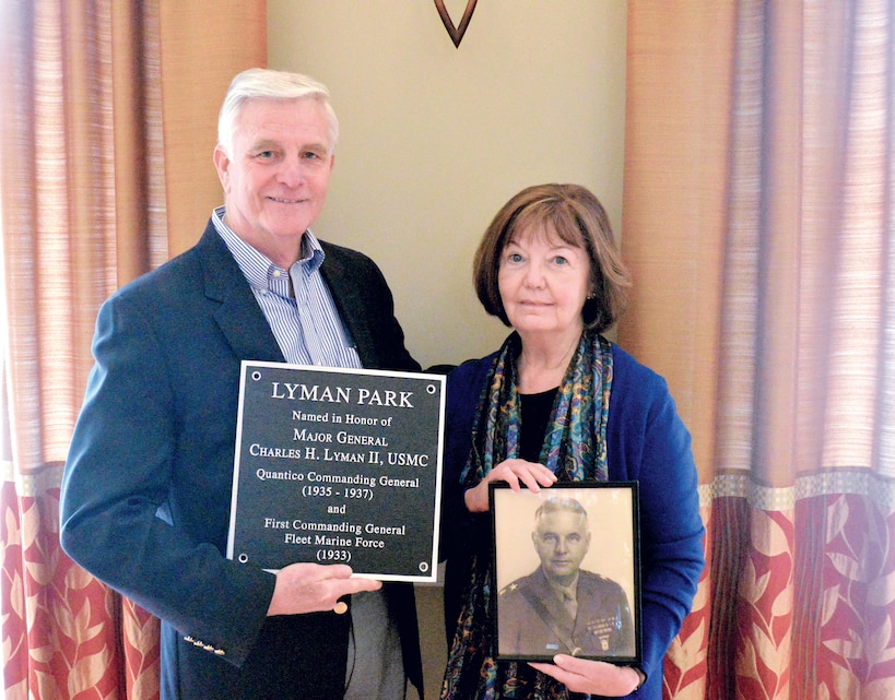 Retired Marine Col. Charles H. Lyman IV joined by his wife, Betsy Lyman, hold memorial plaque in recognition of his grandfather Maj. Gen. Lyman II, in which Lyman Park is named after. The plaque was gifted to the Lincoln Family Housing Center in rememberance of Lyman IV grandfather's acomplishments.