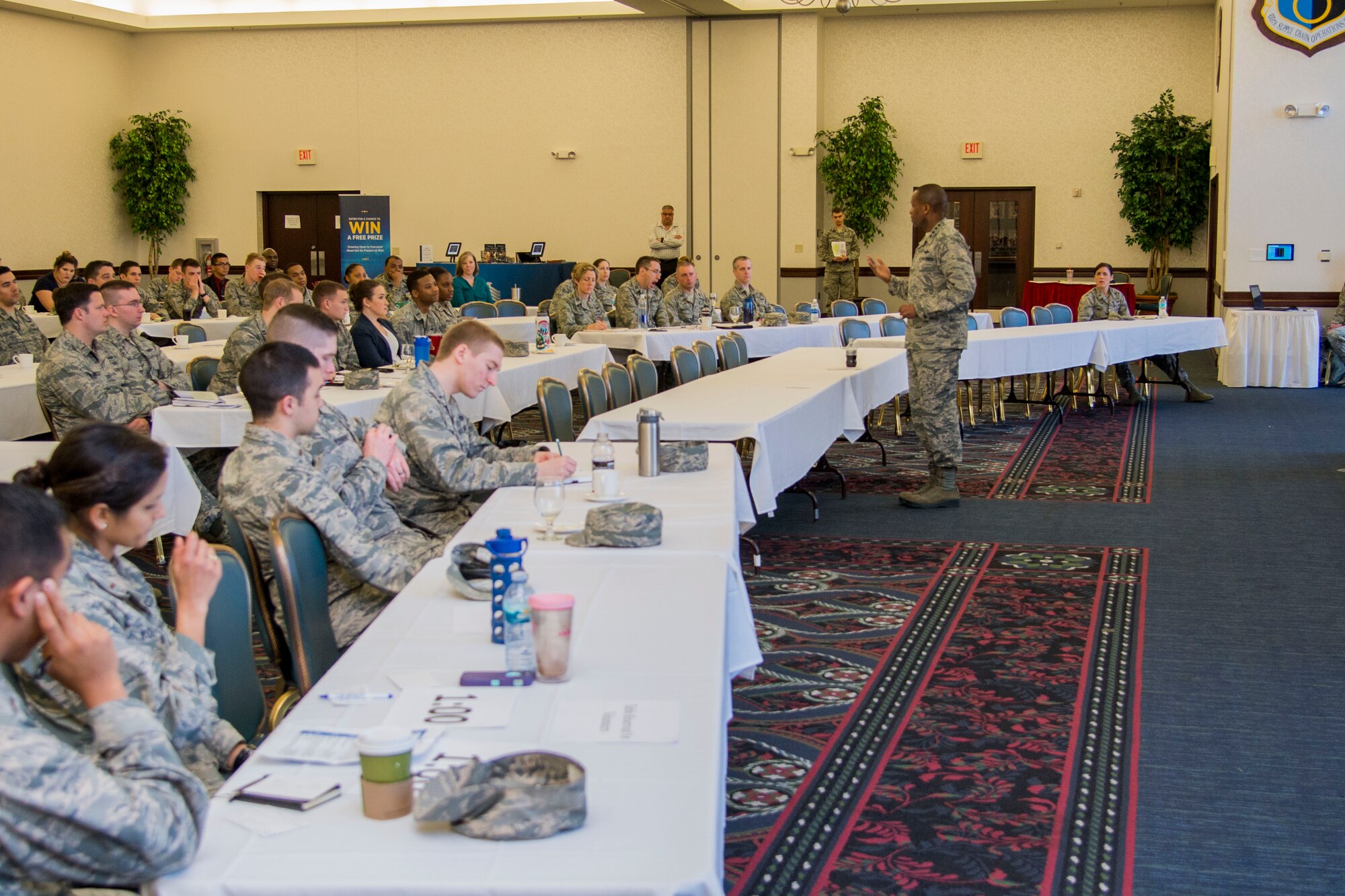 General Darren Mcdew, the U.S. Transportation Command commander, speaks infront of company grade officers during the 5th Annual CGO Conference at the Scott Event Center Feb. 27. McDew spoke about the importance of figuring out what kind of workers are in the organization and how to motivate them to go beyond the bare minimum.(U.S. Air Force photo by Airman Chad Gorecki)