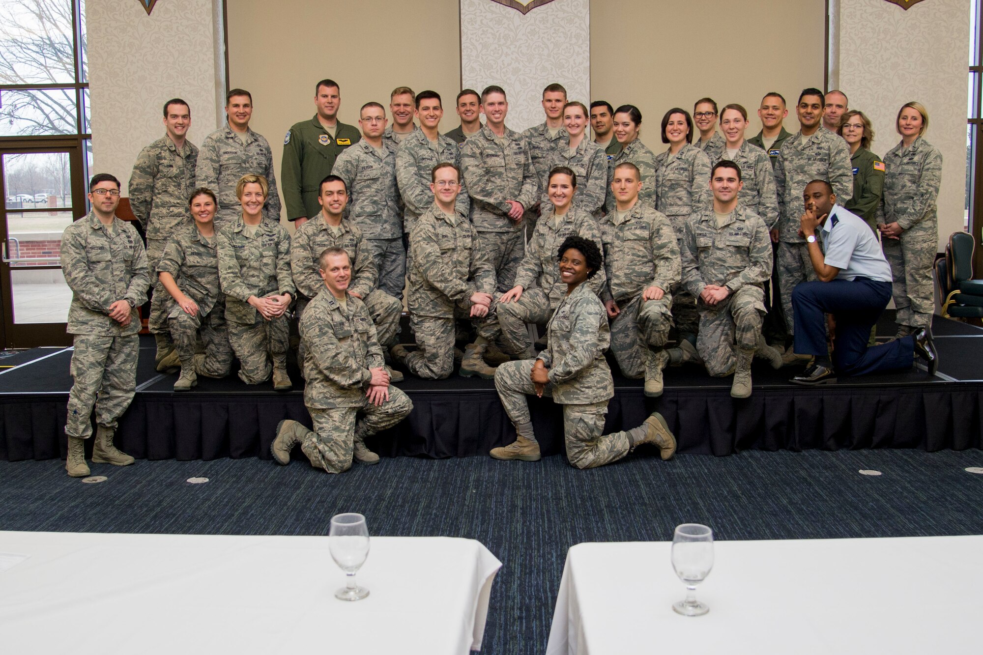 Company Grade Officers pose for a group photo at the end of the 5th Annual CGO Conference at the Scott Event Center Feb. 28. The two-day conference allowed the CGO's to listen to and interact with field grade officers and enlisted members about their experiences with the overall theme being "leadership through adversity." (U.S. Air Force photo by Airman Chad Gorecki)