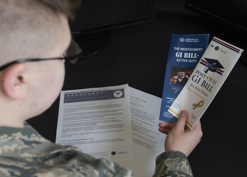 Airman Dalton Shank, 5th Bomb Wing Public Affairs broadcast journalist apprentice, reads pamphlets on the Montgomery GI Bill and the Post-9/11 GI Bill at Minot Air Force Base, N.D., March 10, 2017. A higher education can be achieved with little to no cost by utilizing the services offered through the Air Force. (U.S. Air Force photo/Airman 1st Class Alyssa M. Akers)