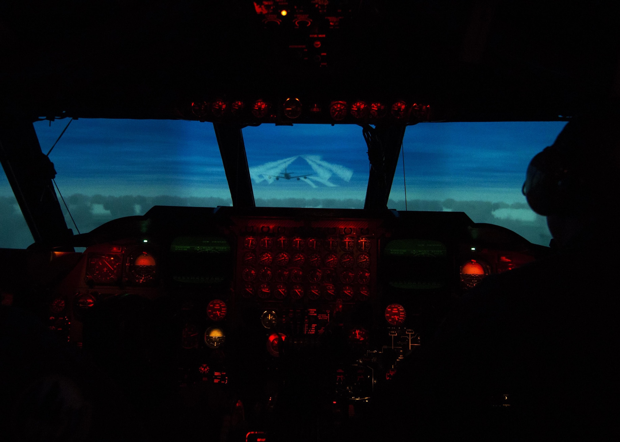 Maj. Craig Clark, 69th Bomb Squadron pilot, and 1st Lt. Wade Waldmann, 69th BS co-pilot, operate the B-52H Stratofortress weapons system trainer during a simulated flight at Minot Air Force Base, N.D., March 8, 2017. The WST has the capability to record every action taken during the simulation for the crew to review later. (U.S. Air Force photo/Airman 1st Class Alyssa M. Akers)