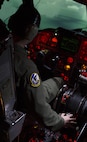 Maj. Craig Clark, 69th Bomb Squadron pilot, tilts the B-52H Stratofortress in the B-52 weapons system trainer during a simulated flight at Minot Air Force Base, N.D., March 8, 2017. The WST has undergone numerous modifications through its lifetime to ensure similarities stay the same between the simulator and the aircraft. (U.S. Air Force photo/Airman 1st Class Alyssa M. Akers)