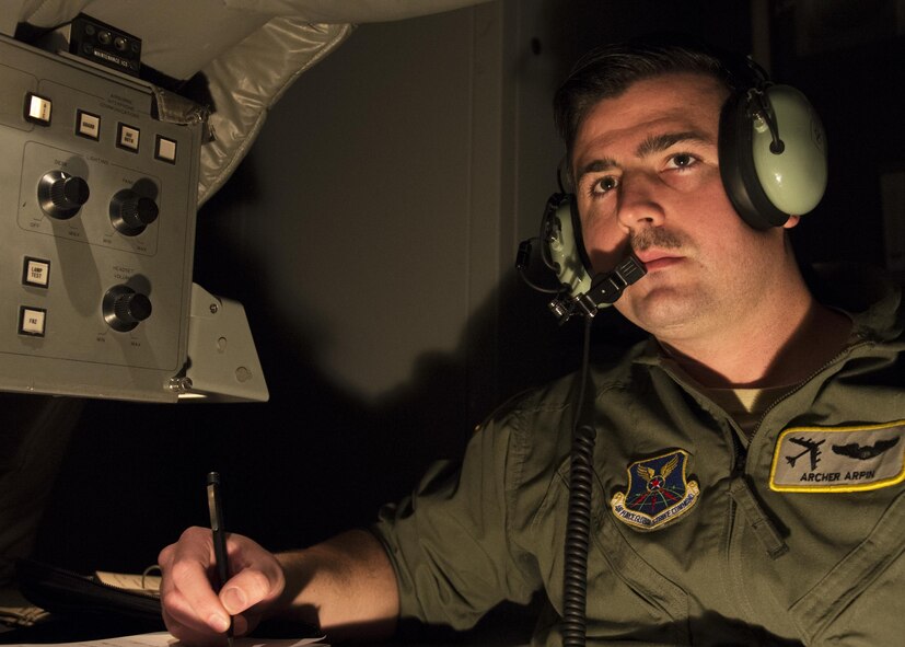 Capt. Kevin Arpin, 69th Bomb Squadron instructor pilot, inspects the pilots on the proper use of the controls of a B-52H Stratofortress during a simulated flight in the B-52 weapons system trainer at Minot Air Force Base, N.D., March 8, 2017. The WST is used to train and certify aircrews in normal flight, emergencies and combat scenarios. (U.S. Air Force photo/Airman 1st Class Alyssa M. Akers)