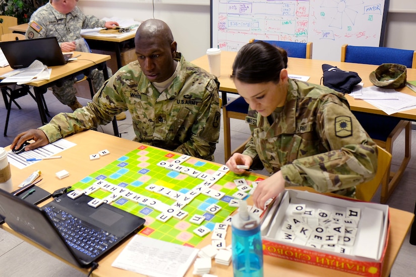 KAISERSLAUTERN, Germany-Sgt. Maj. Bobby White, left and Sgt. Justine Westbrook, both from the 361st Civil Affairs Brigade, play a Russian version of Scrabble for practice during their four-day class to learn Russian Wednesday, March 15, 2017 on Daenner Kaserne in Kaiserslautern, Germany. Seven Army Reserve Soldiers — from the 361st Civil Affairs Battalion headquarters in Kaiserslautern and its down trace unit, the 457th Civil Affairs Battalion in Grafenwoehr — attended the class, taught by Defense Language Institute. 
(Photo by Lt. Col. Jefferson Wolfe, 7th Mission Support Command Public Affairs Office)