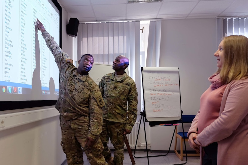 KAISERSLAUTERN, Germany- Sgt. Randall Green, left, and Sgt. Maj. Bobby White, center, from the 361st Civil Affairs Brigade, identify Russian words on a screen pronounced by the instructor, Irina Mikhailova, from the Defense Language Institute March 15, 2017. 
(Photo by Lt. Col. Jefferson Wolfe, 7th Mission Support Command Public Affairs Office)