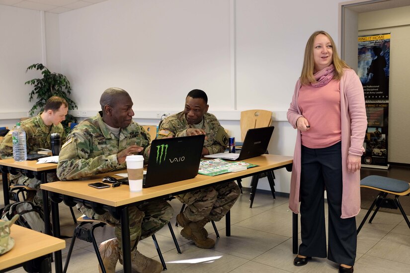 KAISERSLAUTERN, Germany — Sgt. Maj. Bobby White, left, and Sgt. Randall Green, center, from the 361st Civil Affairs Brigade, share a laugh during Russian Language class with Irina Mikhailova, right, a Russian language instructor from Defense Language Institute, Wednesday, March 15, 2017 on Daenner Kaserne in Kaiserslautern, Germany. 
(Photo by Lt. Col. Jefferson Wolfe, 7th Mission Support Command Public Affairs Officer)