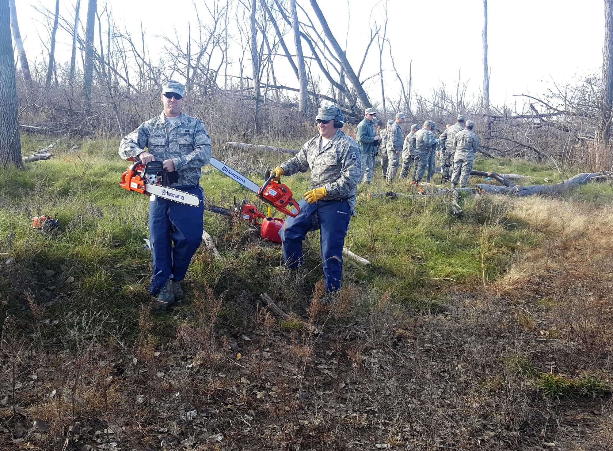 185th Air Refueling Wing Civil Engineers Iowa Air National Guard in Sioux City, Iowa use chain saws that are part of domestic operations debris clean up package, to cut fallen trees at an Army National Guard training site adjacent the Sioux City Airport, during the November, 2016 training weekend. (185th ARW photo/released) 