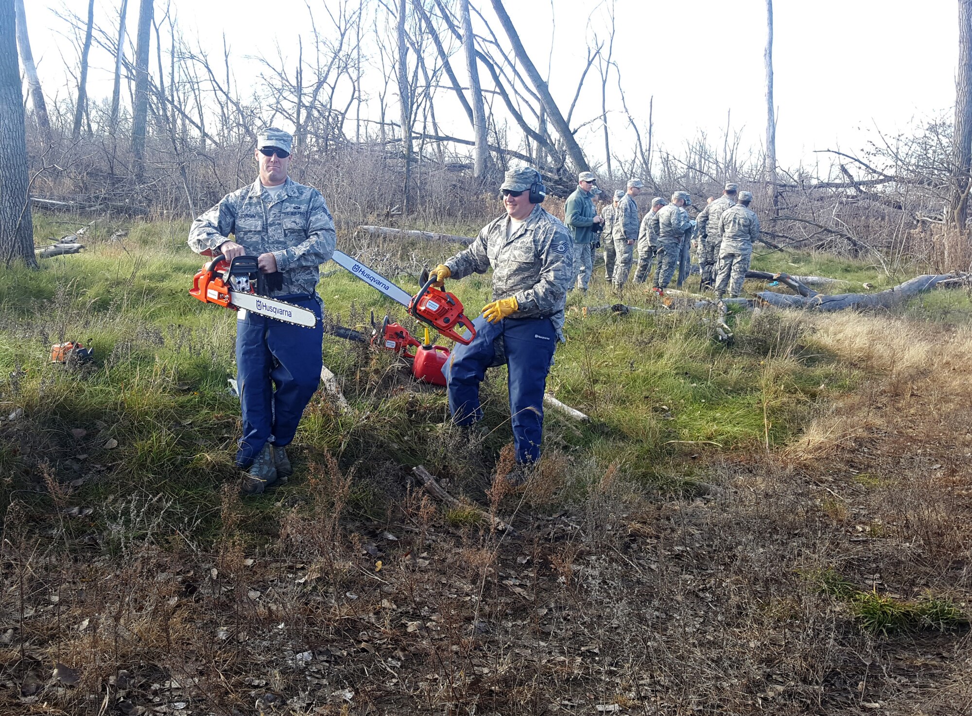 185th Air Refueling Wing Civil Engineers Iowa Air National Guard in Sioux City, Iowa use chain saws that are part of domestic operations debris clean up package, to cut fallen trees at an Army National Guard training site adjacent the Sioux City Airport, during the November, 2016 training weekend. (185th ARW photo/released) 