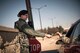 U.S. Air Force Airman 1st Class Kayla Brooks, a security forces specialist with the 182nd Security Forces Squadron, Illinois Air National Guard, returns a military identification card to its owner while posted as an installation entry controller at the 182nd Airlift Wing, Peoria, Ill., March 3, 2017. Security forces Airmen serve as the first line of defense for their bases and fellow Airmen. (U.S. Air National Guard photo by Tech. Sgt. Lealan Buehrer)