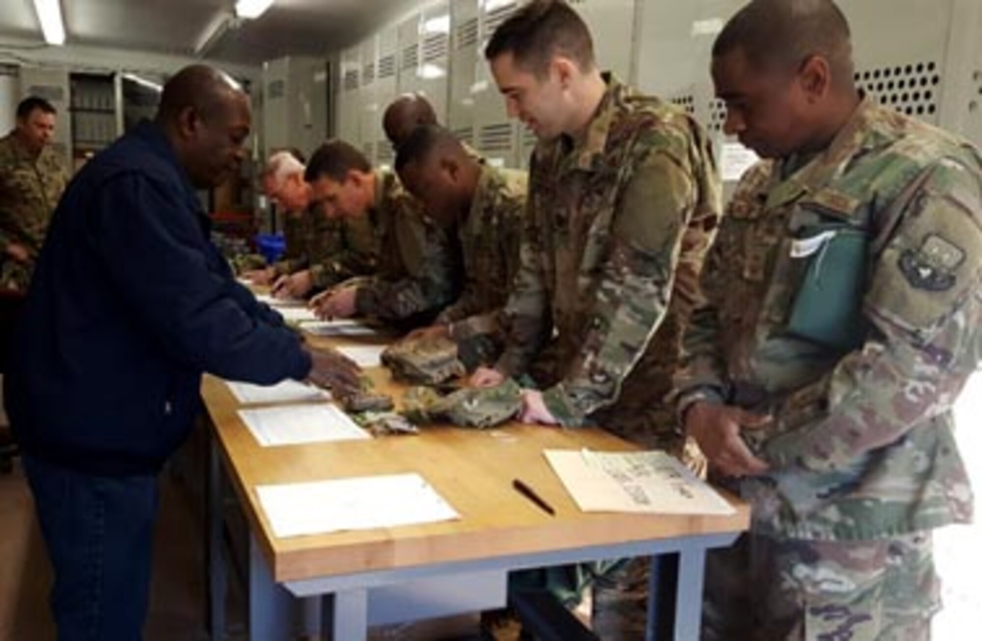 Airmen attending the 602nd Training  Group (Provisional)’s Combat Advisor Course process through an equipment issue line Jan. 24, 2017, at Fort Polk, La. During the course Airmen receive instruction on interpersonal communication skills including: using an interpreter, cross-cultural communication, negotiating techniques, leader engagements, building rapport and understanding human behavior. (U.S. Air Force photo by Master Sgt. Michael Sheets) 