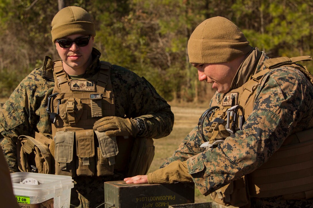 Marines prepare an expedient claymore at Engineer Training Area 7 on Camp Lejeune, N.C., March 15, 2017. The Marines are undergoing basic demolitions training to increase proficiency and confidence with the employment of basic and expedient demolition charges. The Marines are with Combat Logistics Battalion 22, Headquarters Regiment. (U.S. Marine Corps photo by Pfc. Abrey Liggins)