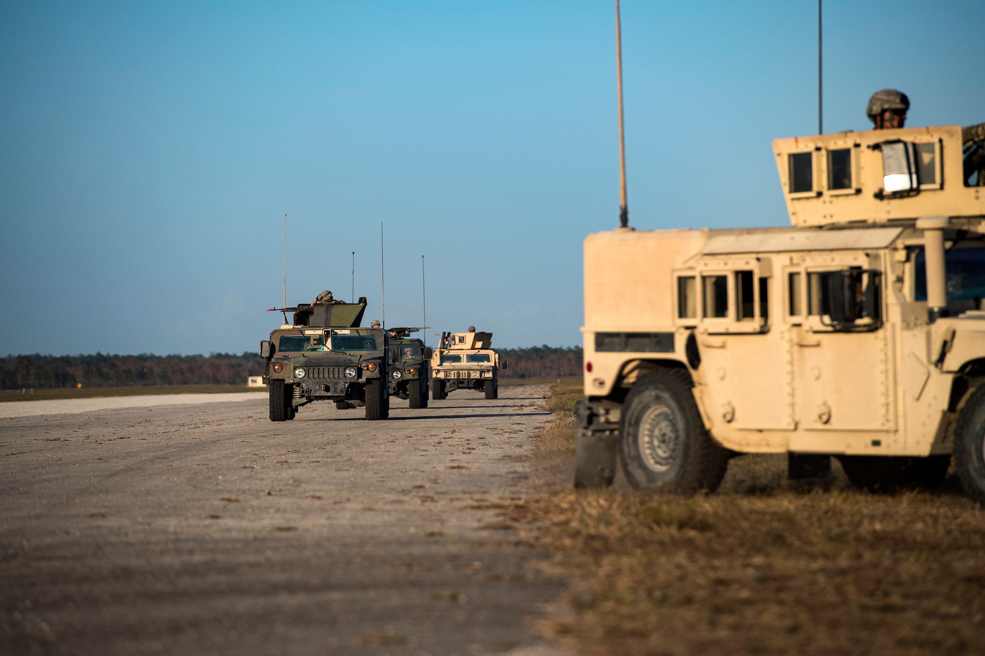 Airmen drive Humvees back to base after patrolling the surrounding area during a Mission Readiness Exercise, March 11, 2017, at Avon Park Air Force Range, Fla. As the 822d Base Defense Squadron‘s only vehicle maintainer, Staff Sgt. Joel Kirtley, 822d BDS NCO in charge of vehicular equipment, is responsible for anything with a motor, from Humvees to golf carts and generators. (U.S. Air Force photo by Airman 1st Class Janiqua P. Robinson)