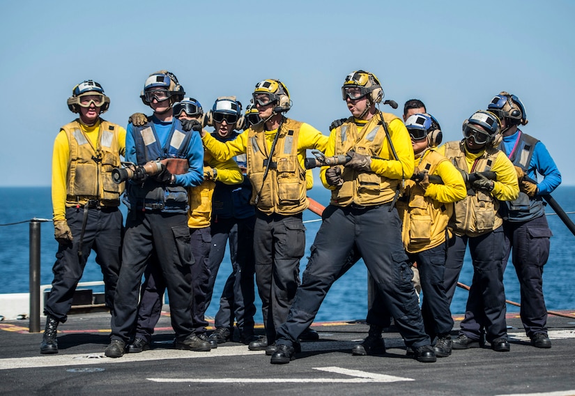 U.S. 5TH FLEET AREA OF OPERATIONS (March 8, 2017) Sailors fight a simulated fire during an aviation fire drill aboard the amphibious assault ship USS Makin Island (LHD 8). Makin Island is deployed in the U.S. 5th Fleet area of operations in support of maritime security operations designed to reassure allies and partners, and preserve the freedom of navigation and the free flow of commerce in the region. (U.S. Navy photo by Mass Communication Specialist 3rd Class Devin M. Langer)