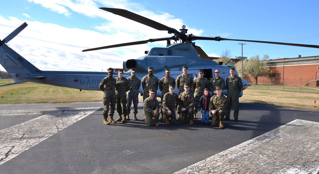 Defense Logistics Agency Aviation Marines meet with Marine Corps Maj. Kyle Wilt and 1st Lt. Kevin Roth during a landing at Defense Supply Center Richmond, Virginia. The crew from Marine Air Group 29, Marine Light Attack Helicopter Squadron 269 from Marine Corps Air Station New River in Jacksonville, North Carolina flew Huey and Cobra helicopters March 8, 2017 for a meet and greet with DLA Aviation’s employees. (Photo by Jackie Roberts)