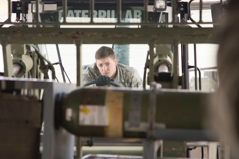 U.S. Air Force Senior Airman Harrison Honeycutt an aerial porter with the 621st Contingency Response Wing, Joint Base McGuire-Dix-Lakehurst, N.J., loads cargo onto a U.S. Air Force C-17 Globemaster III during exercise Crisis Response 2017, March 11, 2017, Gulfport, Miss. The 621st Contingency Response Wing maintains a ready corps of light, lean and agile mobility support forces able to respond as directed by the 18th Air Force at Scott Air Force Base, Ill., in order to meet Combatant Command wartime and humanitarian requirements. (U.S. Air Force photo by Staff Sgt. Robert Waggoner/RELEASED)