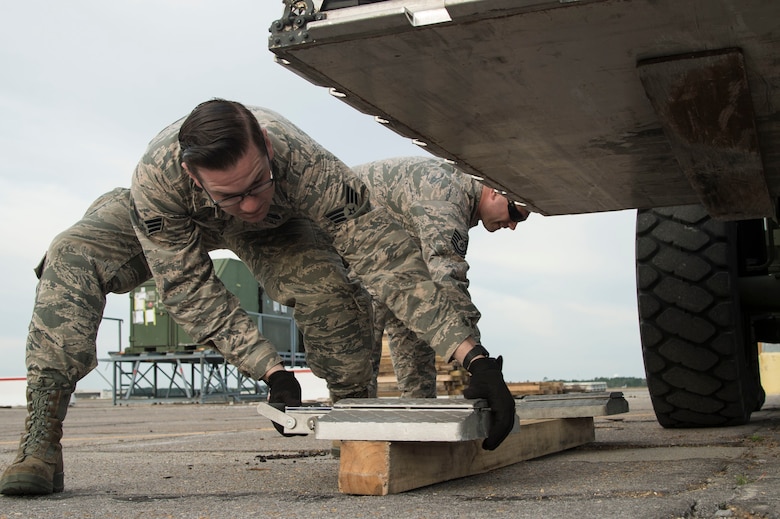 U.S. Air Force Senior Airman  Matthew Welge an aerial porter with the 621st Contingency Response Wing, Joint Base McGuire-Dix-Lakehurst, N.J., weighs cargo during Crisis Response 2017, March 11, 2017, Gulfport, Miss. The 621st consists of approximately 1500 Airmen in three groups, eleven squadrons and more than 20 geographically separated operating locations aligned with major Army and Marine Corps combat units.(U.S. Air Force photo by Staff Sgt. Robert Waggoner/RELEASED)
