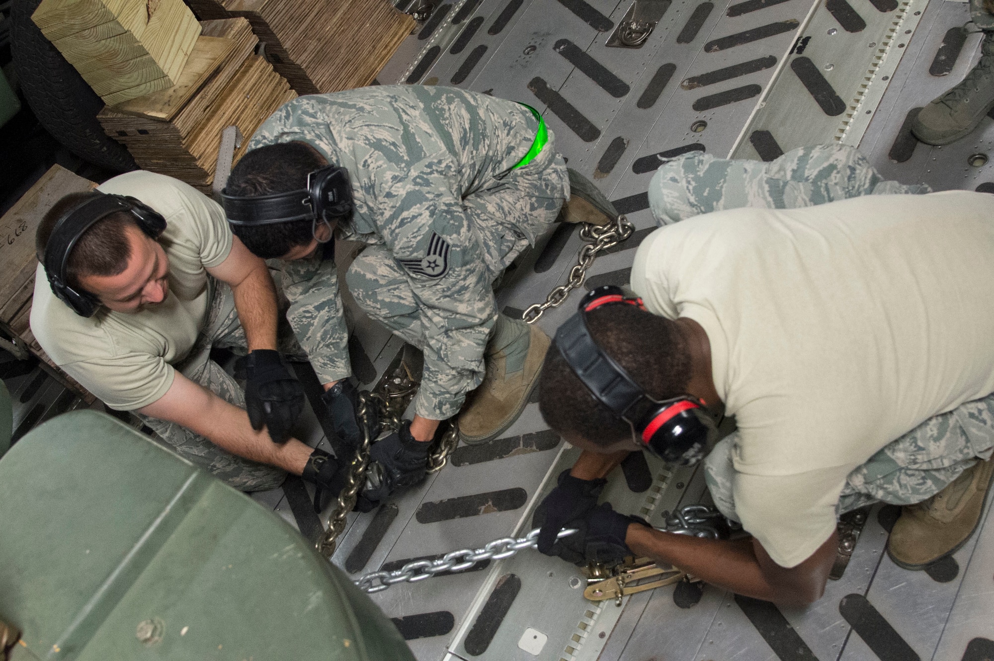 Airmen from the 621st Contingency Response Wing, stationed at Joint Base McGuire-Dix-Lakehurst, N.J., tie down cargo on a U.S. Air Force C-17 Globemaster III, March 11, 2017, Gulfport, Miss. Crisis Response measures the U.S. Air Force capabilities during wartime operations. (U.S. Air Force photo by Staff Sgt. Robert Waggoner/RELEASED)