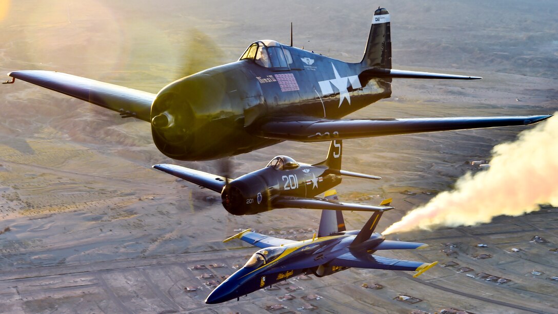 An F/A-18 Hornet with the Blue Angels, the Navy's flight demonstration squadron, flies over the Salton Sea in California with an F6F Hellcat and F8F Bearcat, March 9, 2017. The Hellcat and Bearcat were the first two aircraft models flown by the Blue Angels, shortly after the team’s inception in 1946. Navy photo by Petty Officer 2nd Class Ian Cotter