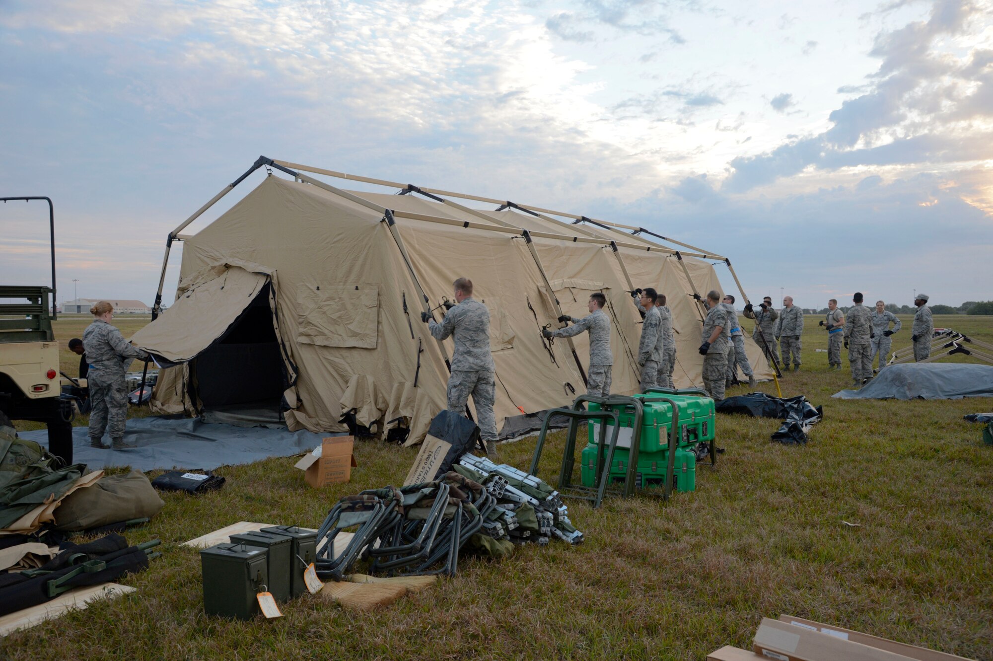 Airmen from the 6th Medical Group build a tent during an aeromedical evacuation exercise at MacDill Air Force Base, Fla., March 12, 2017. The exercise compiled knowledge and hands-on training of site acquirement, set up, patient movement, care and staging. (U.S. Air Force photo by Senior Airman Tori Schultz)
