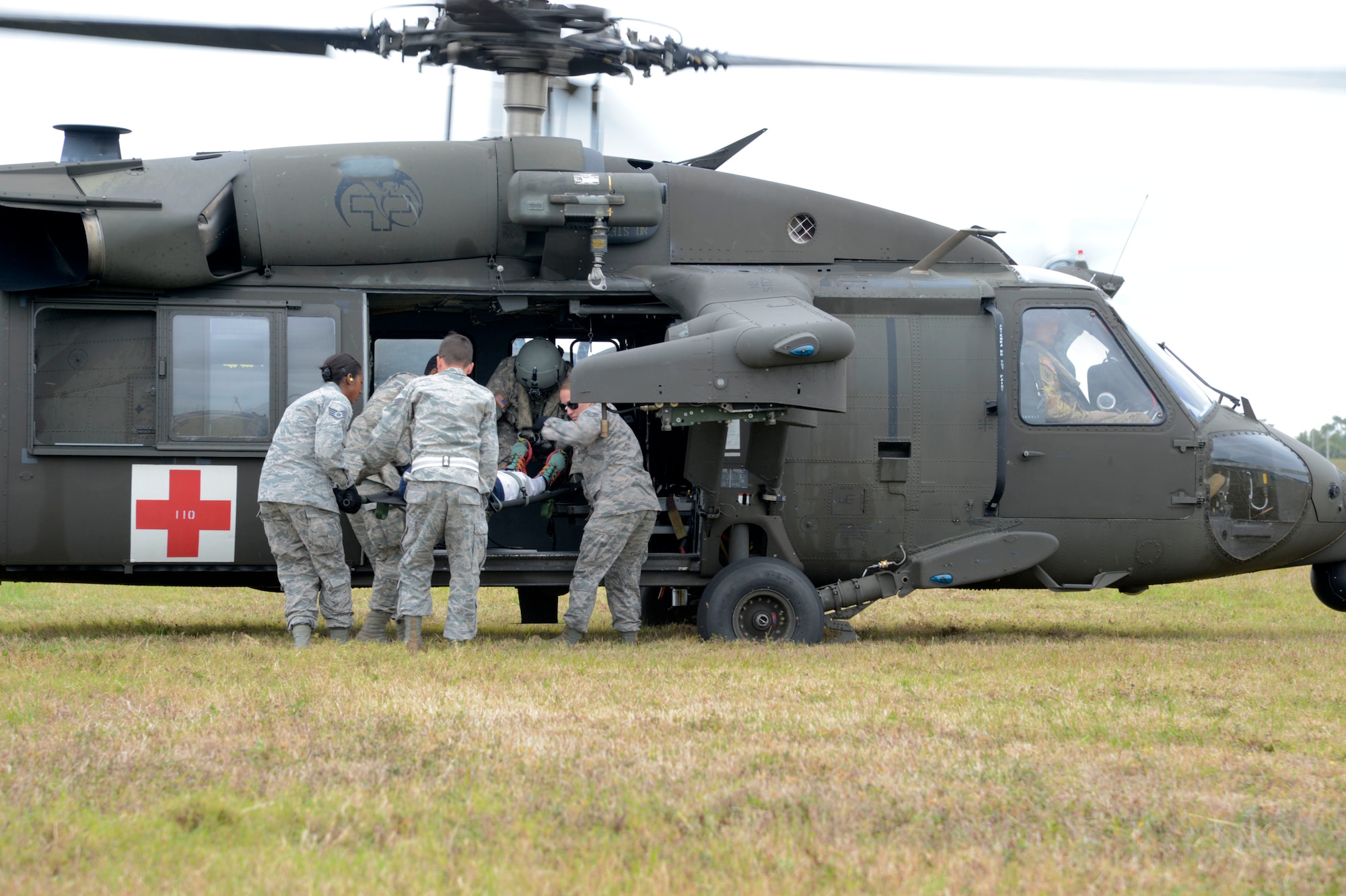 Airmen from the 6th Medical Group practice transporting a patient in a HH-60 Black Hawk helicopter during an aeromedical evacuation exercise at MacDill Air Force Base, Fla., March 12, 2017. Airmen learned how to properly carry and secure a patient and provide patient care in a deployed environment. (U.S. Air Force photo by Senior Airman Tori Schultz)