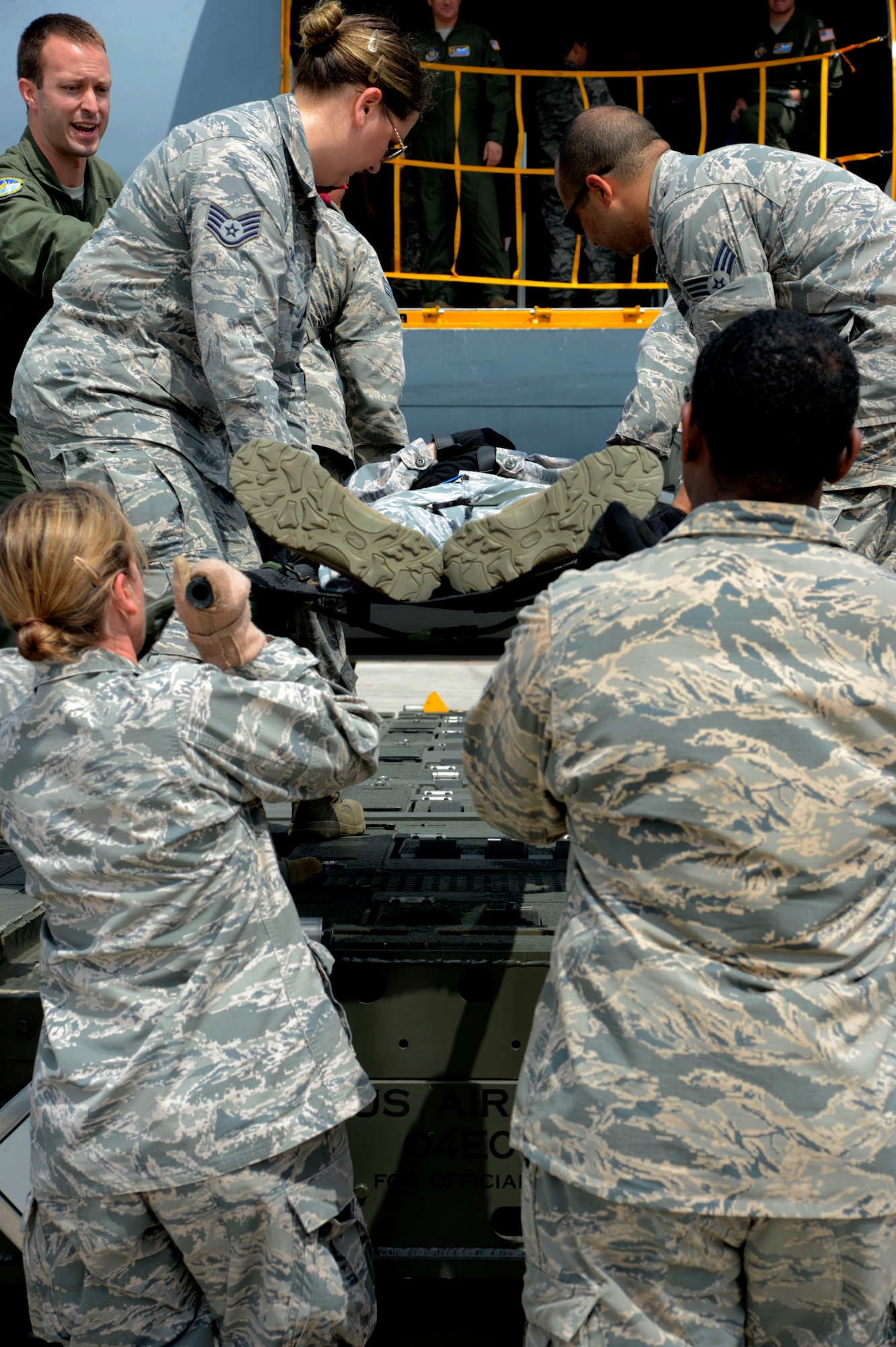 Airmen from the 6th Medical Group practice loading patients onto a KC-135 Stratotanker aircraft during an aeromedical evacuation exercise at MacDill Air Force Base, Fla., March 12, 2017. A K-loader is used to elevate multiple patients on a KC-135. (U.S. Air Force photo by Senior Airman Tori Schultz)